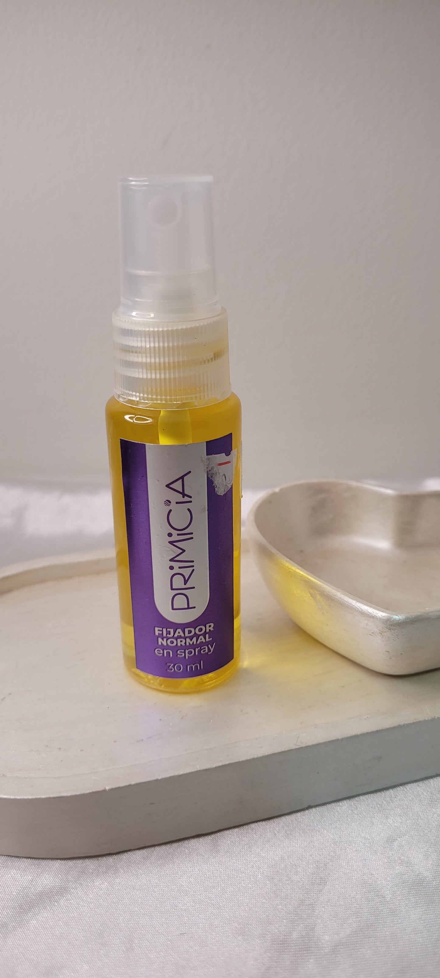 Aceite fijador de cabello